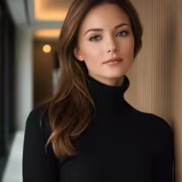a beautiful young lady in black wearing a black turtle neck sweater
