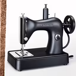 a black machine with a small cord is on display