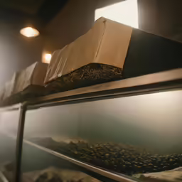 three pizza boxes are on top of the oven