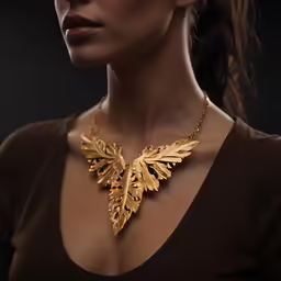 a woman wearing a golden necklace and a dress