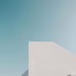 there is a white building with an orange and black bird on the roof