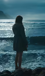 a woman stands on the beach with a lonely look on her face