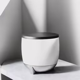 an empty room with a round shaped object sitting on top of a shelf