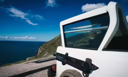 the car is stopped by the water with no other driver