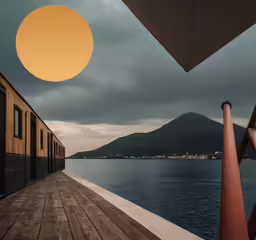an umbrella is on the pier outside of a boat