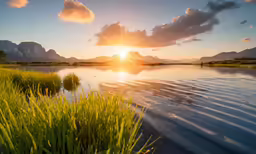 the sun rising over mountains is in the distance on a clear day