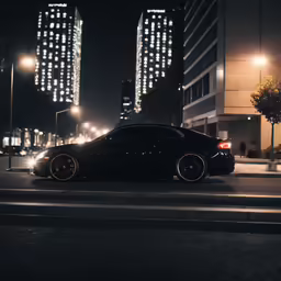 cars on the side of the road and buildings at night