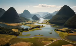 an island with mountains in the distance, surrounded by water