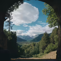 a view of some mountains from a window