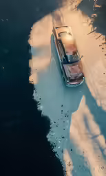 an abandoned car sitting in a puddle of water
