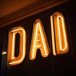 the words dad spelled with lit neon letters