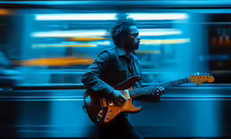 a guy that is playing some kind of guitar