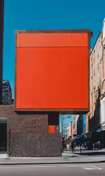 a red brick building has a large rectangular sign