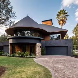 a large modern house with a tall round roof