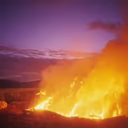 a huge amount of lava rises above a field