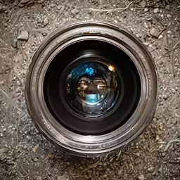 the inside of an empty lens in dirt