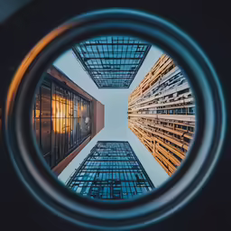 a building looking up through a round hole