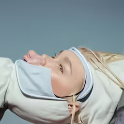 the girl has a sleeping mask on her head