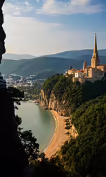 an aerial view of a town, ocean and cliffs