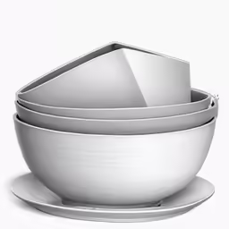 four white dishes are stacked on each other