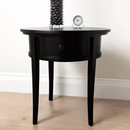 a small table with a clock next to it