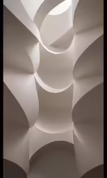 a room filled with white walls and curved walls
