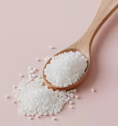 a spoon with a bunch of rice in it