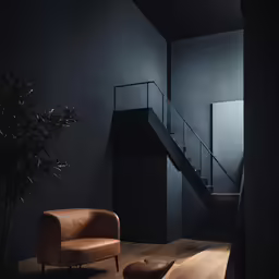 a large room with a chair and a stair case