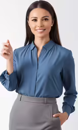 a woman wearing a blue blouse with gray pants