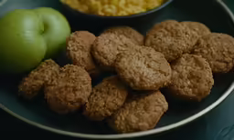 some oatmeal and apples are on a plate