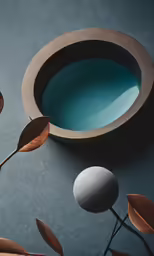 a concrete bowl sitting on top of a table