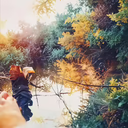 someone has their arm wrapped around a stick near water