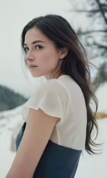 a woman in white and blue posing for the camera