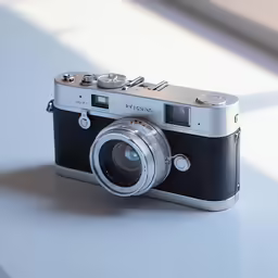an old, black and white digital camera with its lens up