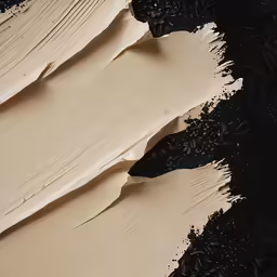 three black and white dunes with brown sand