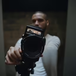 man using a camera to take a picture