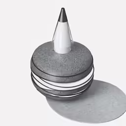 a stack of cement circles with a white hat sitting on top of it