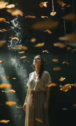 woman standing under falling yellow leaves in a rain storm