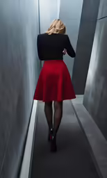 a woman in a short red skirt standing
