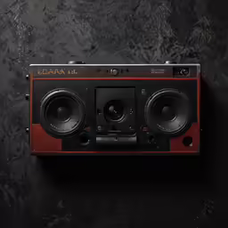 an old radio sits on a table next to speakers