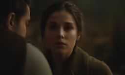 a woman and a man standing next to each other