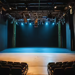 an empty stage with a light above it
