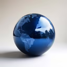 a blue glass globe sitting on top of a table