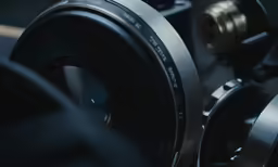 a camera, lens, and other components of a video camera
