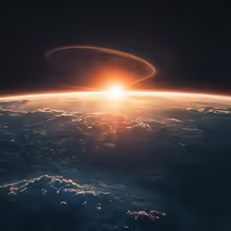 the sun is rising in the middle of the horizon