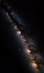 the long section of the milky galaxy has glowing stars