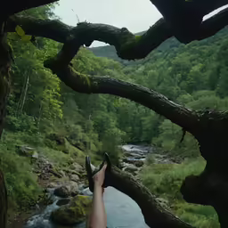 person laying on rock while relaxing in nature