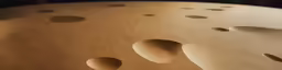 several holes and dots of different shapes in a round surface