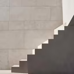 the stairway at the end of a concrete staircase
