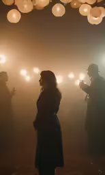 a person that is standing in the dark